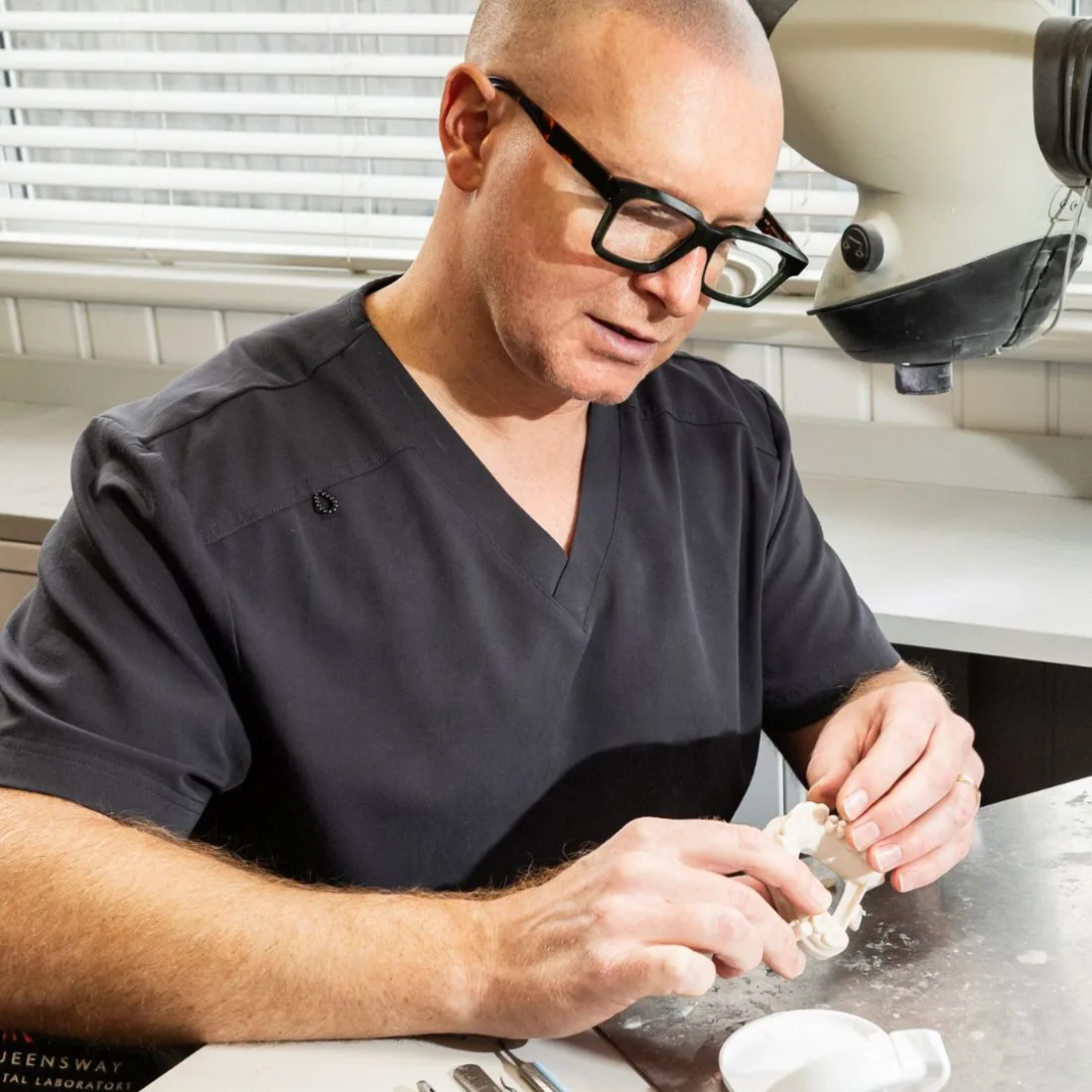 A patient at a dental bridge fitting appointment at Queensway Dental A patient at a dental bridge fitting appointment at Queensway Dental