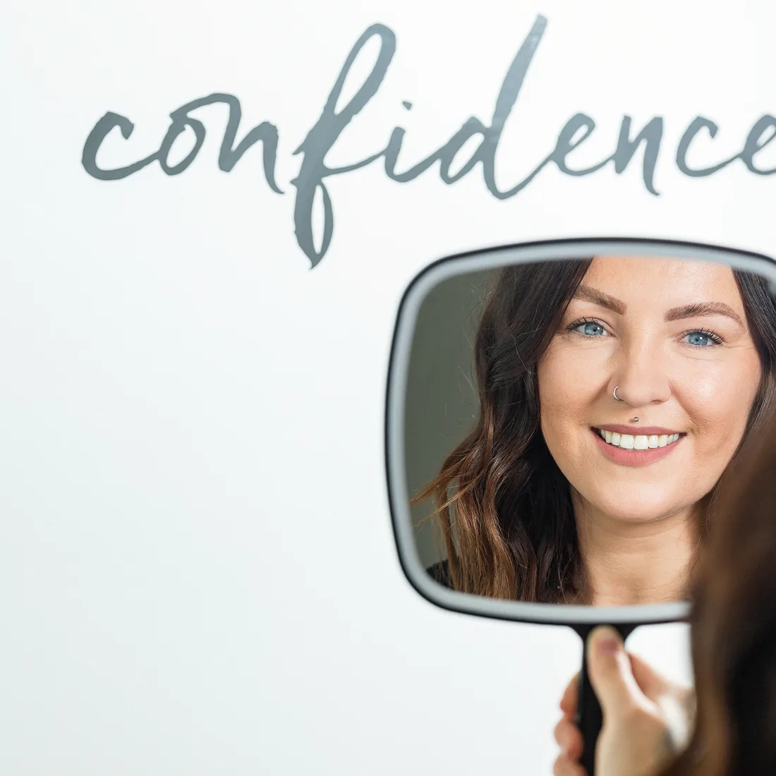 Patient enjoying her confident smile after composite bonding at Queensway Dental Patient enjoying her confident smile after composite bonding at Queensway Dental