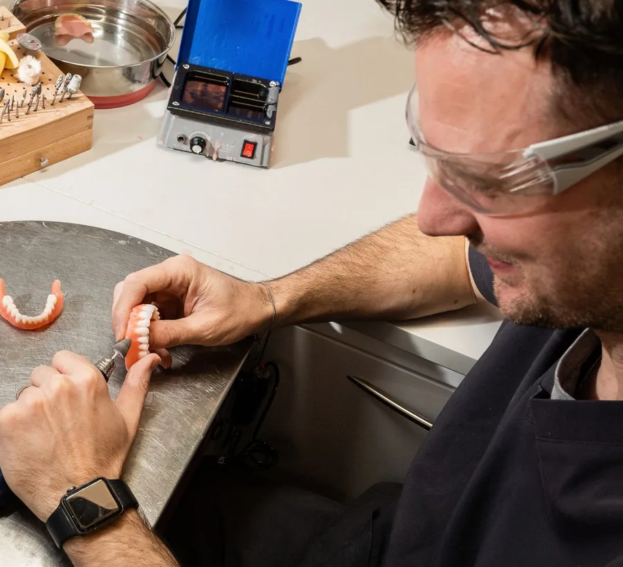 A clinician demonstrating a technique to colleagues during a Queensway Dental training session