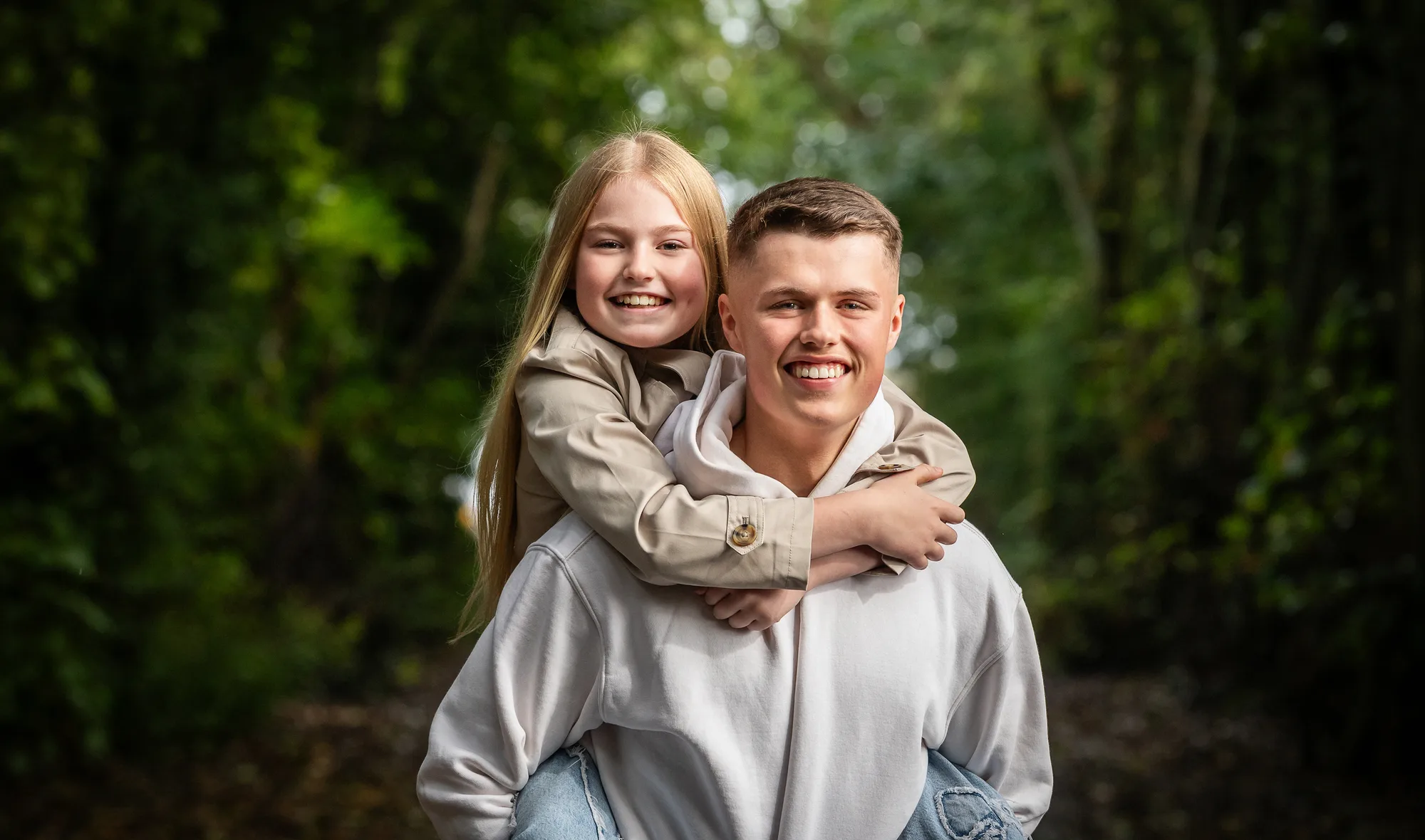 A family with healthy smiles after a routine check-up at Queensway Dental A family with healthy smiles after a routine check-up at Queensway Dental