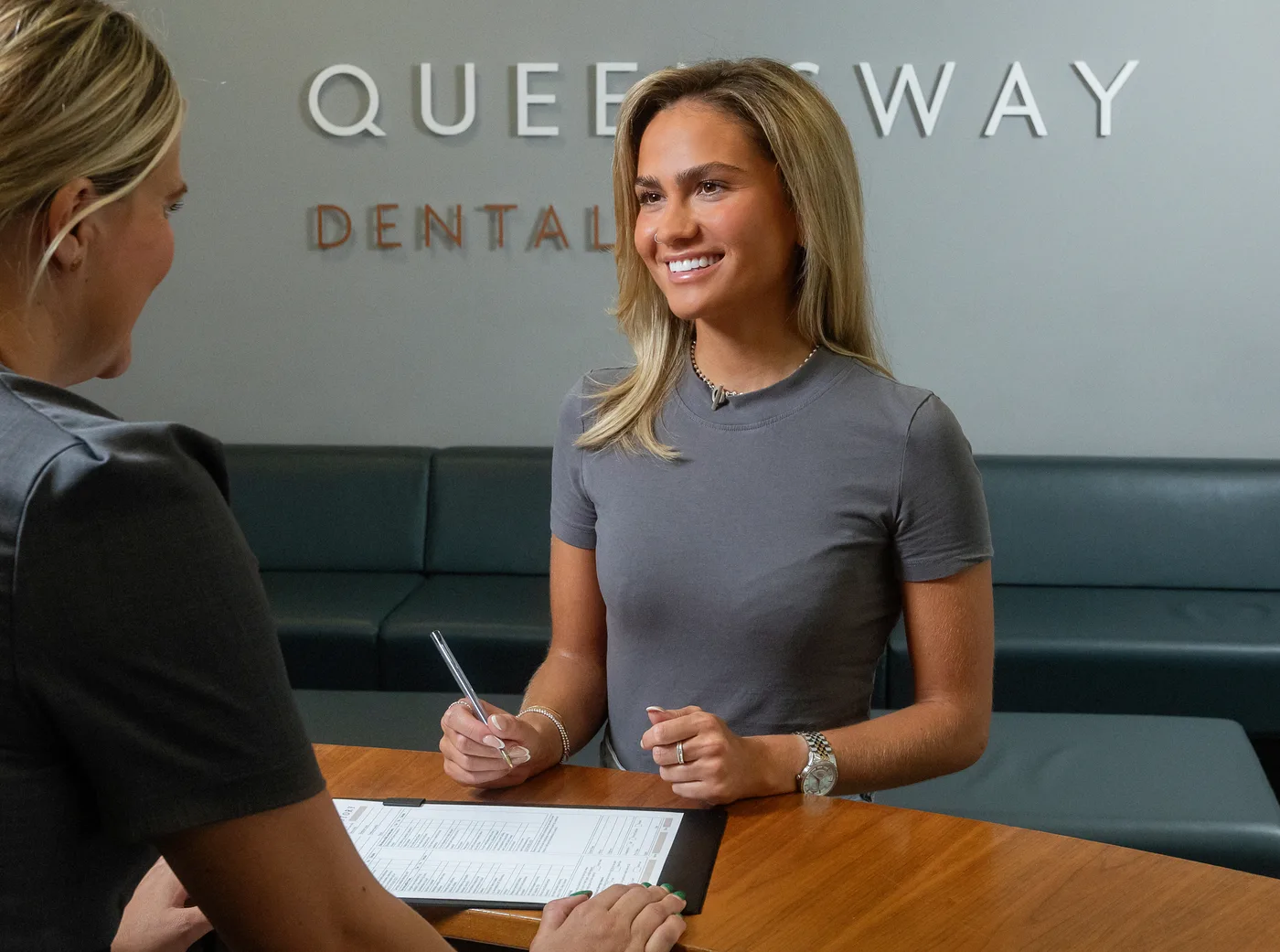 A patient being welcomed for gentle, supportive care at Queensway Dental A patient being welcomed for gentle, supportive care at Queensway Dental