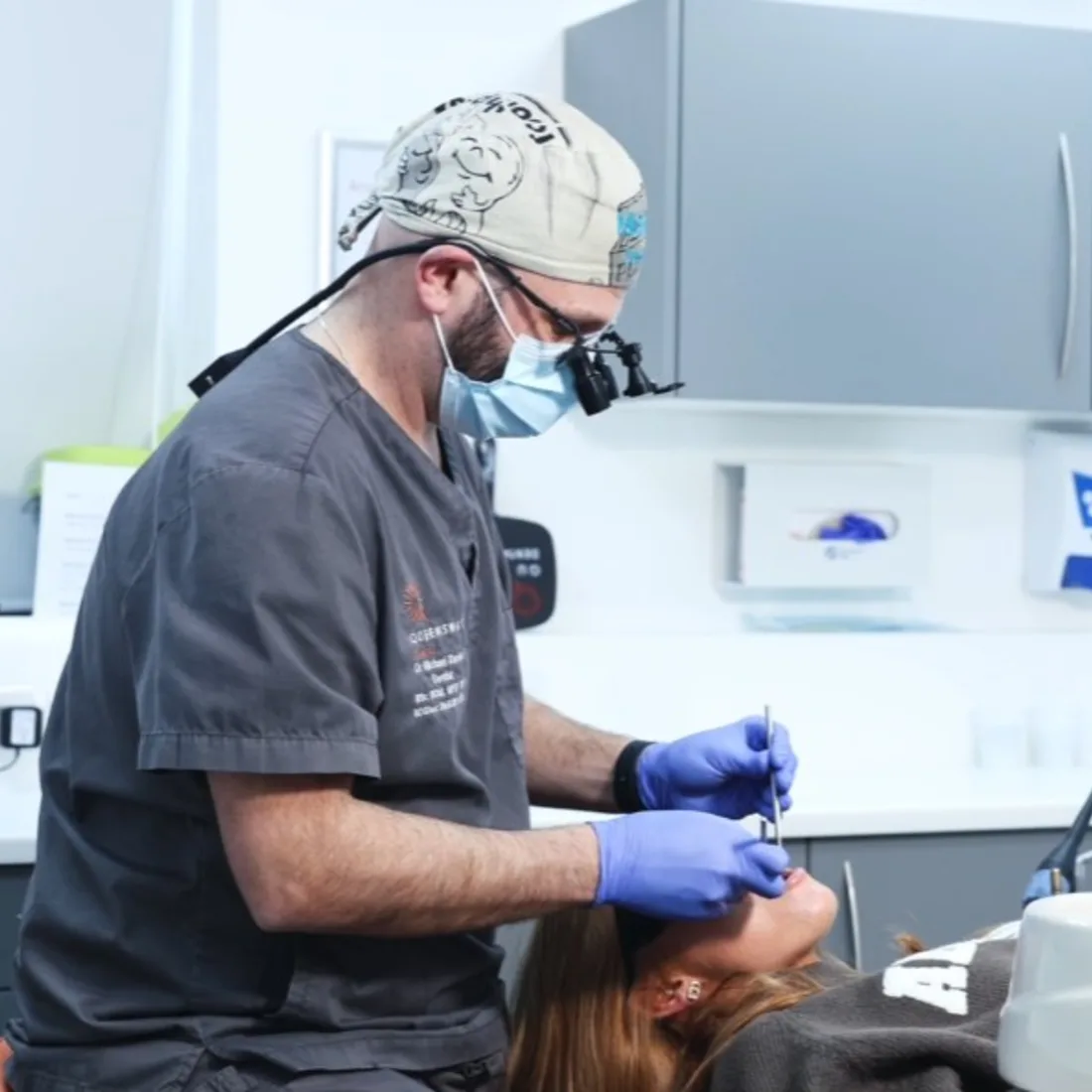 Oral surgeon explaining a clear, personalised treatment quote to a patient Oral surgeon explaining a clear, personalised treatment quote to a patient