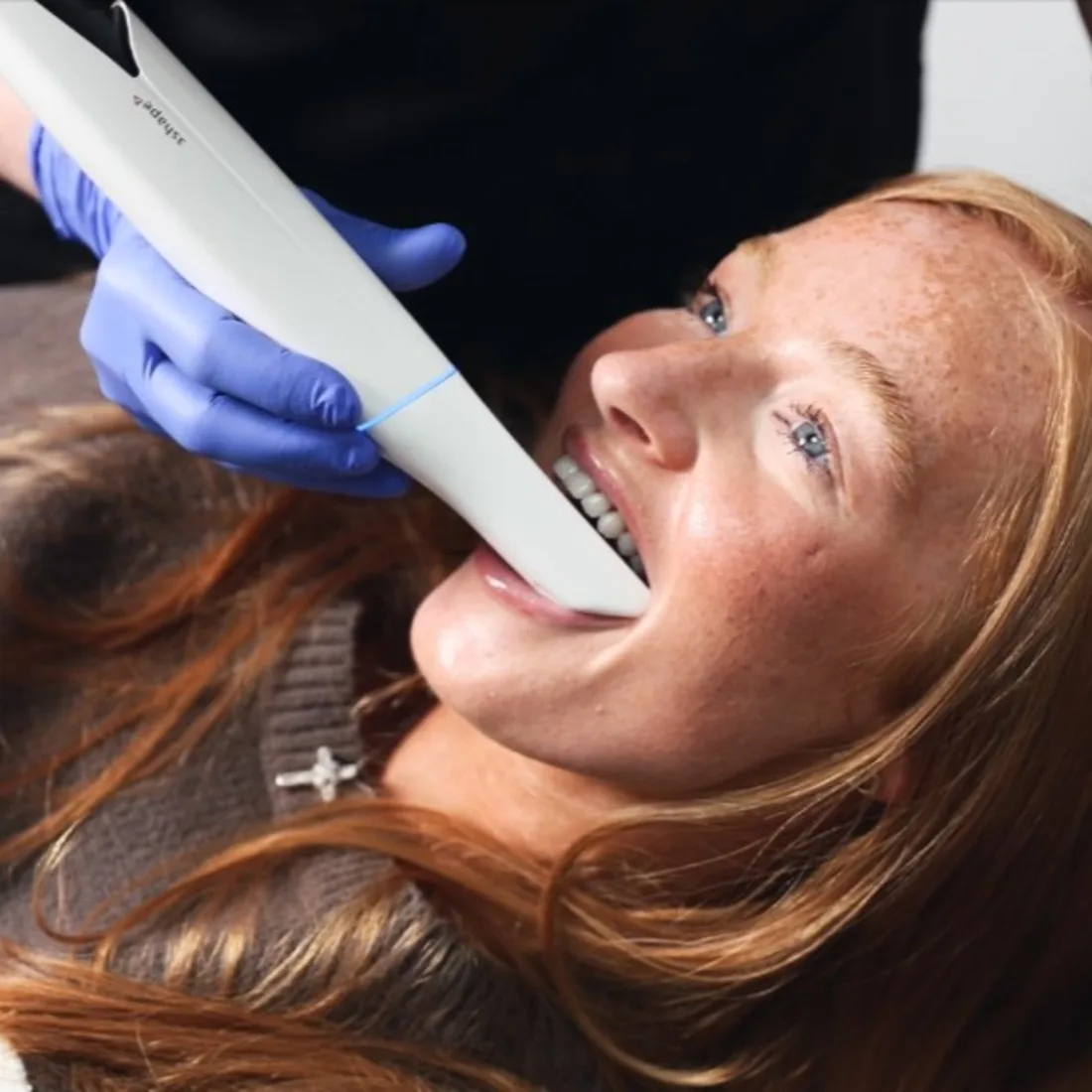 Queensway dentist assessing a patient's smile for whitening